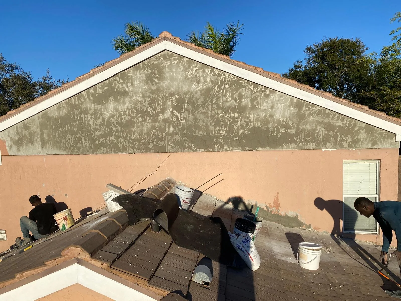 Exterior gable wall during stucco resurfacing